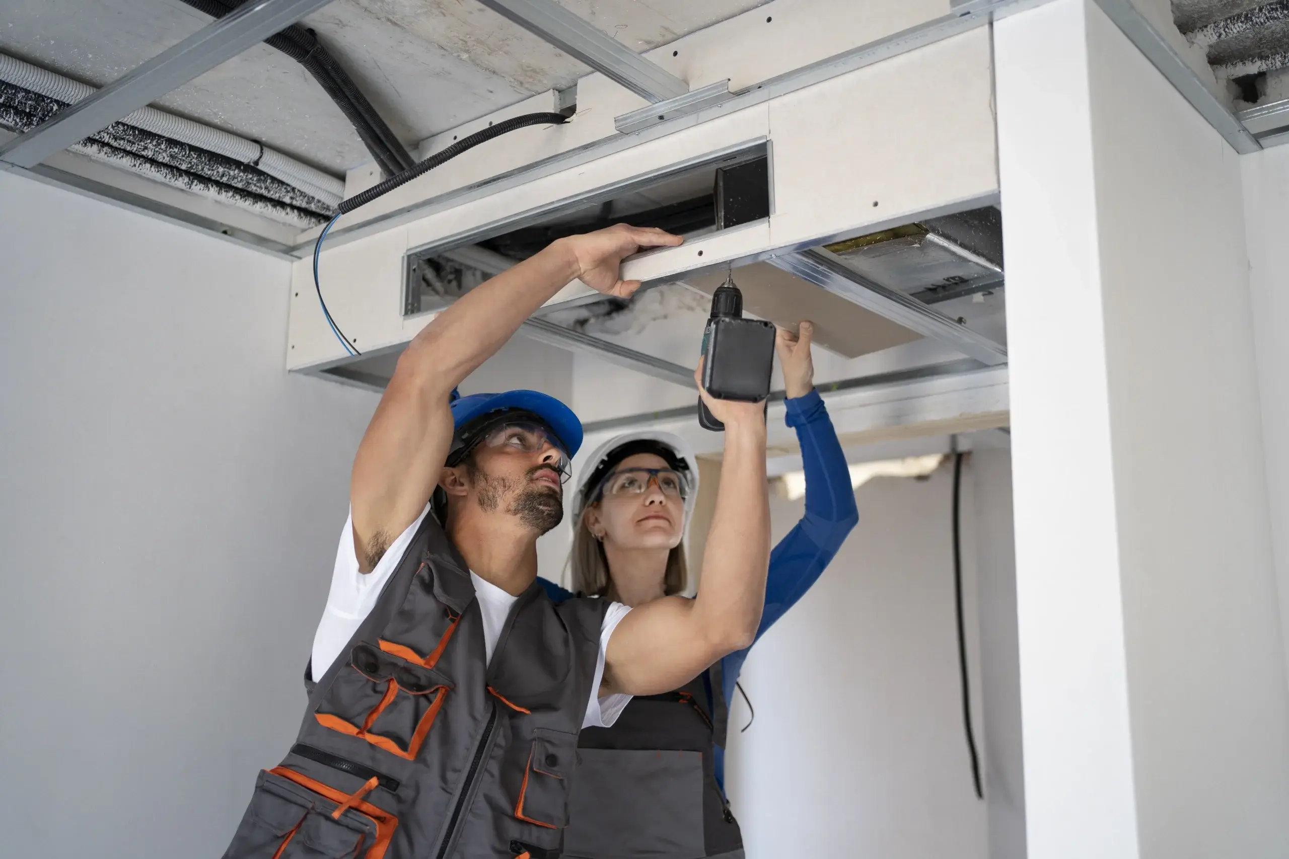 medium-shot-people-wearing-safety-helmets https://acductfixingdubai.com/wp-content/uploads/2025/09/medium-shot-people-wearing-safety-helmets-scaled.webp